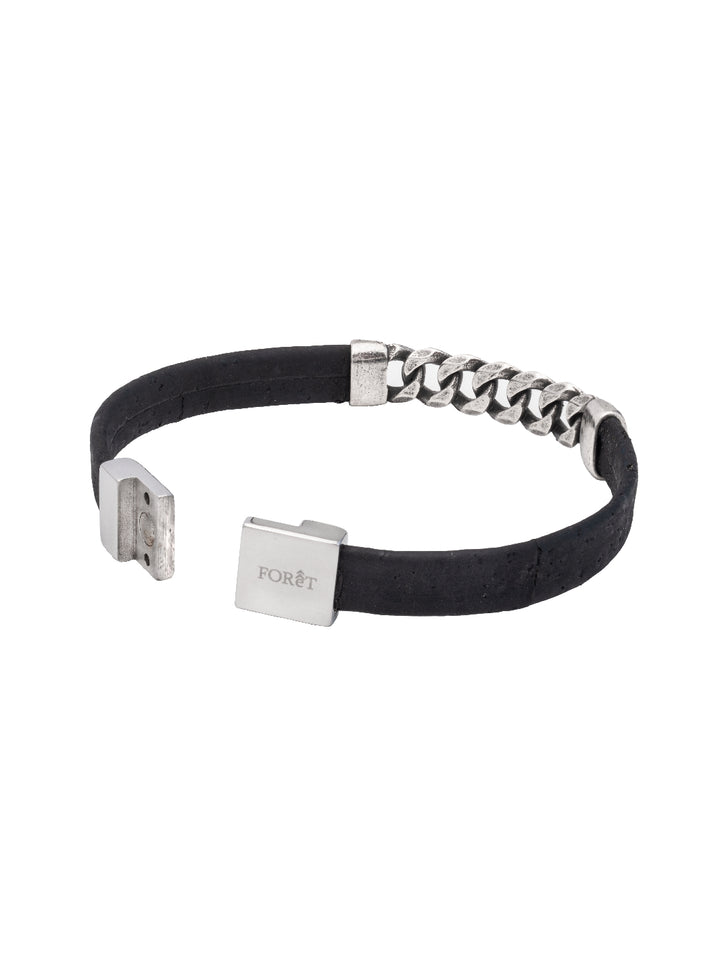 Introducing the SteelLink Elegance Cork Bracelet: sustainable style in black. Crafted with cork, metal, and stainless steel, it's lightweight and chic with a magnetic clasp. Comes in an elegant pouch. Perfect for any occasion.